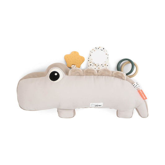 Der perfekte Tummy-Time-Trainer! Das weiche Kissen in Krokodil-Form stützt den Oberkörper, stärkt Nacken und Rücken und fördert die Motorik deines Babys.